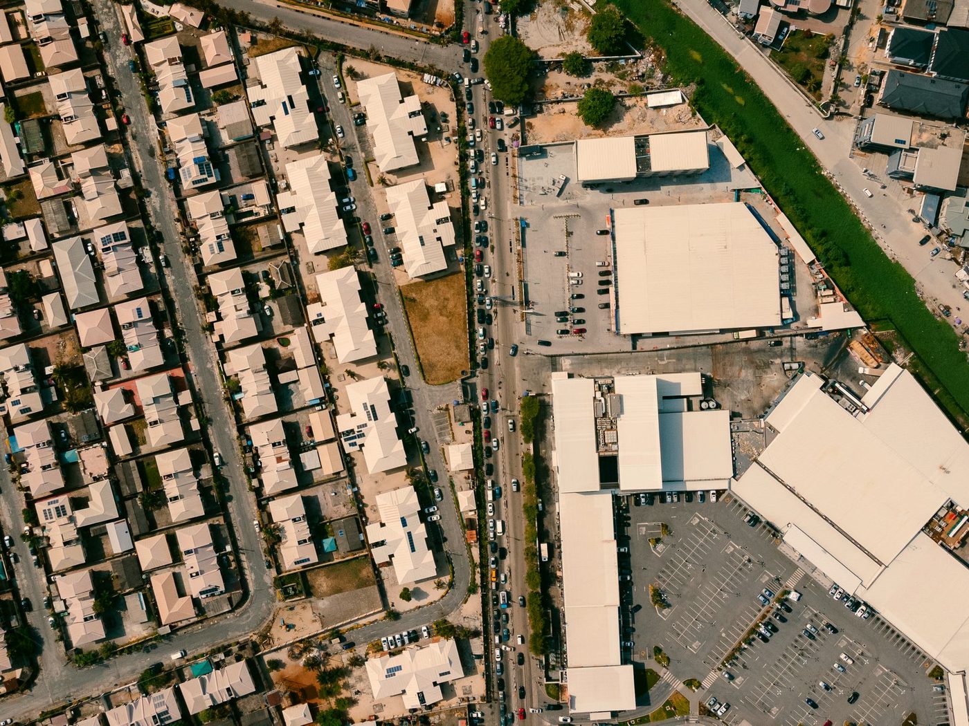 Aerial view of rows of completed terraced housing in a Nigerian residential estate.